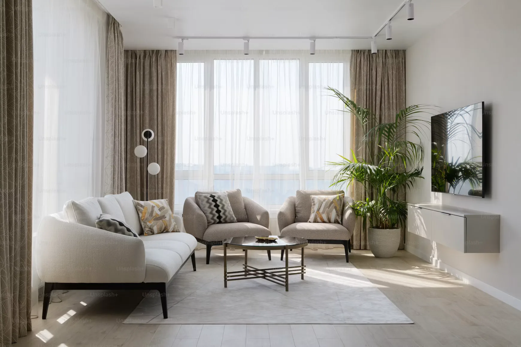 Modern living room with designer furniture and natural light